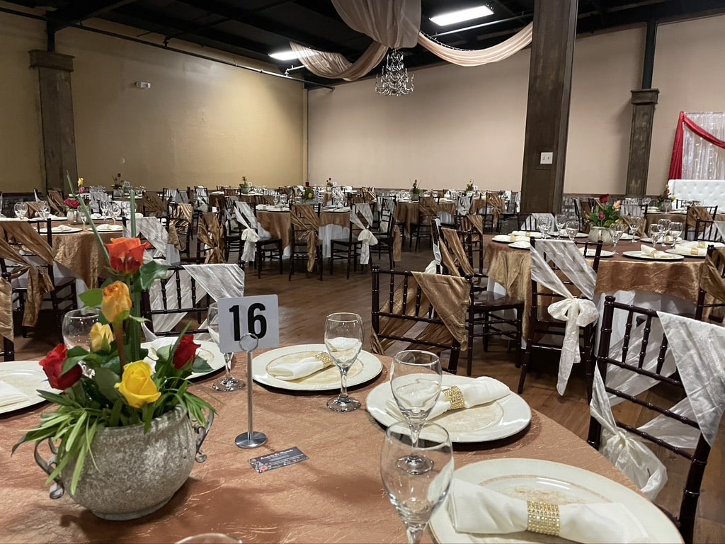 Ballroom reception at wedding venue Gainesville GA with warm uplighting
