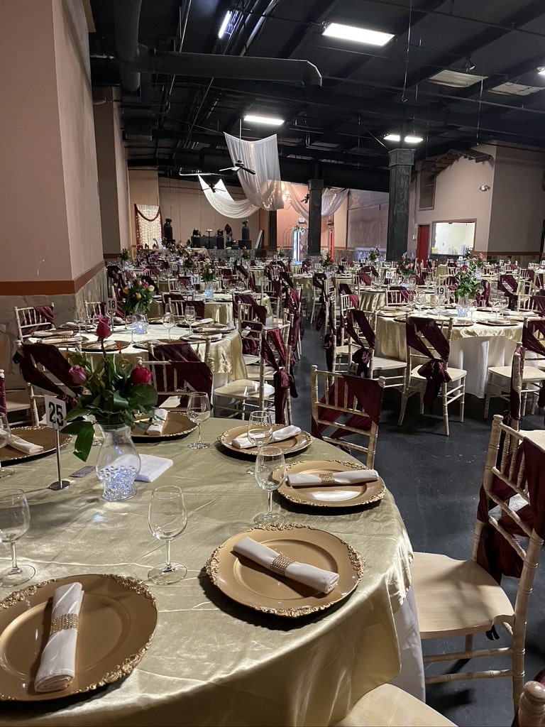 Father-daughter dance under chandeliers — quinceanera venue in gainesville ga
