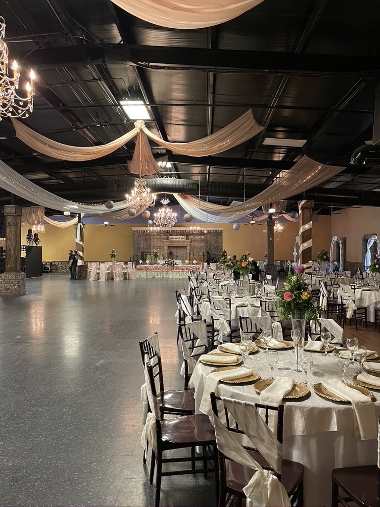 Event Venue Pricing ballroom setup in Gainesville GA with chandeliers and draping